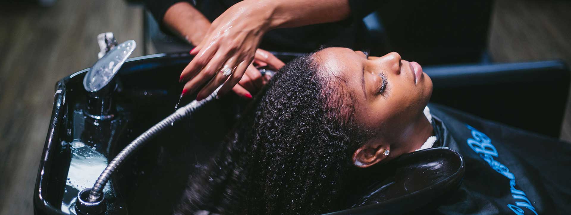 Woman Curly Hair Getting A Hydration Treatment.